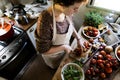 Woman slicing tomatoes for pasta sauce Royalty Free Stock Photo