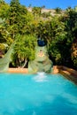 Woman in the water slides of a park or a resort Royalty Free Stock Photo