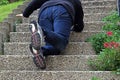 A woman slipped on a staircase and fell down