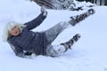 A woman slips on a snowy road