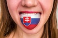 Woman with slovakian flag on the tongue
