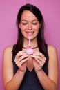 Woman with a small birthday cake