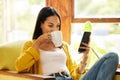 Woman, smartphone and coffee, social media and communication, technology and scroll internet. Online chat, female relax