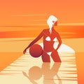 Woman in a swimsuit stands in the water and holding ball on the Sunset.