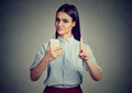 Woman with smartphone showing no, don`t, with finger gesture. Parental control concept Royalty Free Stock Photo