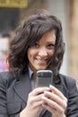 Woman with smartphone walking