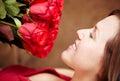 Woman, smell roses and smile for valentines day gift, present and celebration of love, floral fragrance and bouquet Royalty Free Stock Photo