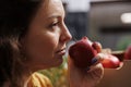 Woman smelling bio apples