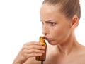 Woman smelling bottle Royalty Free Stock Photo