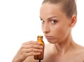 Woman smelling bottle Royalty Free Stock Photo