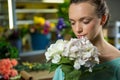 Woman smelling a bunch of flowers Royalty Free Stock Photo