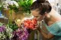 Woman smelling a bunch of flowers Royalty Free Stock Photo