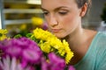 Woman smelling a bunch of flowers Royalty Free Stock Photo