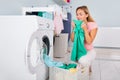 Woman Smelling Clothes After Washing