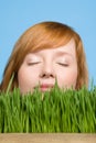 Woman smelling grass Royalty Free Stock Photo