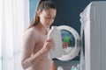 Woman smelling the laundry detergent Royalty Free Stock Photo