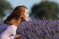 Woman smelling lavender in a beautiful field Royalty Free Stock Photo