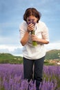 Woman smelling lavender flowers Royalty Free Stock Photo
