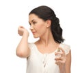 Woman smelling perfume on her hand Royalty Free Stock Photo