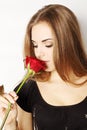 Woman smelling a red rose Royalty Free Stock Photo