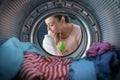 Woman smelling a scented laundry detergent Royalty Free Stock Photo