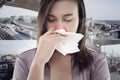 Woman smelling toxic smoke on city background Royalty Free Stock Photo