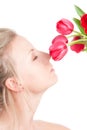 Woman smells bunch of flowers