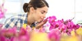 Woman smells the flowers in garden, fragrance of orchids