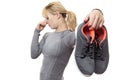 Woman with smelly shoes Royalty Free Stock Photo