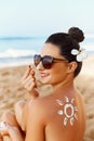 Woman smile applying sun cream on face. Skin care. Body Sun protection. sunscreen. Female smear moisturizing lotion on skin.Ski