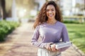 Woman with smile, books and education with student on campus, learning with scholarship at university and outdoor Royalty Free Stock Photo