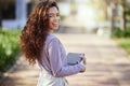 Woman with smile, books and student in campus garden, university and education with learning material for studying Royalty Free Stock Photo