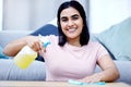 Woman, smile and cleaning house in portrait with spray bottle, rag and disinfectant for hygiene. Fluid, soap and cloth Royalty Free Stock Photo