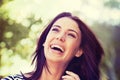 Woman, smile and laugh with nature, sunshine and park for happiness and wellness. Person, joy and bokeh with closeup