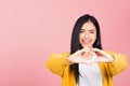 Woman smile make finger heart gesture figure symbol shape sign Royalty Free Stock Photo