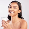 Woman with smile in portrait, glass of milk and health with nutrition, vitamins and calcium on studio background