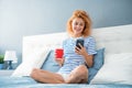 woman smile surfing internet on phone. woman surfing internet at home with phone. internet surfing Royalty Free Stock Photo