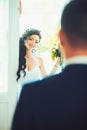 Woman smile to man on wedding day. Happy bride and groom. Sensual woman with bridal makeup and hairstyle. Fashion girl Royalty Free Stock Photo