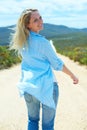 Woman, smile and walking on path, portrait and fun on holiday, vacation and getaway, adventure and joy. Female person Royalty Free Stock Photo