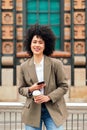 woman smiles happy with a mobile phone in the hand Royalty Free Stock Photo