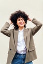 woman smiles happy shaking her curly hair Royalty Free Stock Photo