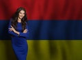 Woman smiling against Armenian flag background Royalty Free Stock Photo