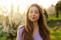 Woman smiling with closed eyes taking deep breath celebrating freedom. Positive human emotion face expression feeling life Royalty Free Stock Photo