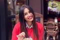 Woman smiling eating desert in a french restaurant. Royalty Free Stock Photo