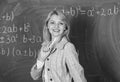 Woman smiling educator classroom chalkboard background. Working conditions for teachers. She likes her job. Back to Royalty Free Stock Photo