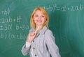 Woman smiling educator classroom chalkboard background. Working conditions for teachers. She likes her job. Back to Royalty Free Stock Photo