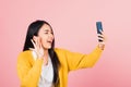 Woman smiling excited  making selfie photo, video call on smartphone Royalty Free Stock Photo