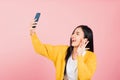 woman smiling excited making selfie photo, video call on smartphone Royalty Free Stock Photo