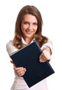 Woman smiling while holding book