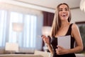 Woman smiling and holding clean paper